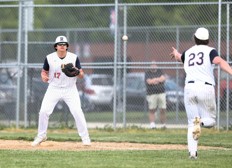 Rochester first baseman Ajay Runkel receives the ball from pitcher Jack Swaney for an out during a nonconference baseball game against Sacred Heart-Griffin on Friday, May 10, 2024. SHG won 4-1.