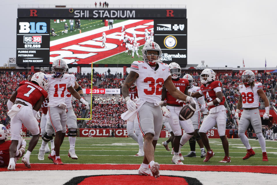 PISCATAWAY, NEW JERSEY - NOVEMBER 4: Running back TreVeyon Henderson #32 of the Ohio State Buckeyes scores a touchdown against the Rutgers Scarlet Knights during the third quarter of a college football game at SHI Stadium on November 4, 2023 in Piscataway, New Jersey. Ohio State defeated Rutgers 35-16. (Photo by Rich Schultz/Getty Images)