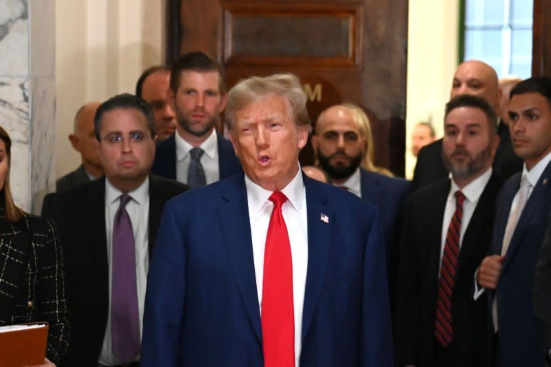 Former President Donald Trump exits the courtroom with his son Eric, left background, in his civil fraud trial at State Supreme Court on Thursday in New York City. Photo by Louis Lanzano /UPI