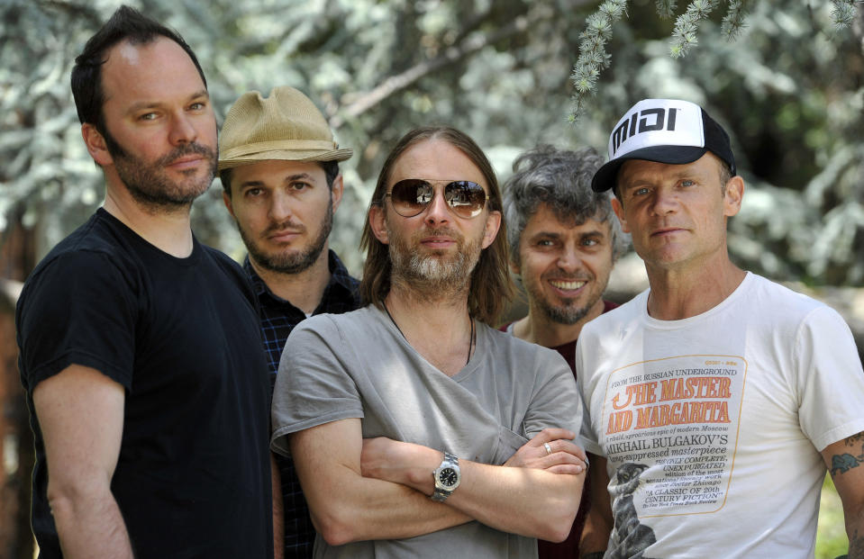 This May 22, 2013 photo shows members of Atoms For Peace , from left, Nigel Godrich, Joey Waronker, Thom Yorke, Mauro Refosco and Flea posing for a portrait in Los Angeles. The band's 27-date tour begins in July in Europe and will reach the US in September before ending in Japan. (Photo by Chris Pizzello/Invision/AP)