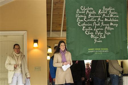 Relatives of the victims killed in the Sandy Hook Elementary School tragedy in Newtown, Connecticut arrive to give a statement regarding the formation of the website mysandyhookfamily.org just before the one year anniversary of the disaster in Sandy Hook, Connecticut December 9, 2013. REUTERS/Lucas Jackson