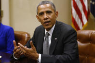 President Barack Obama meets with small business owners about the government shutdown and debt ceiling, Friday, Oct. 11, 2013, in the Roosevelt Room of the White House in Washington. (AP Photo/Charles Dharapak)