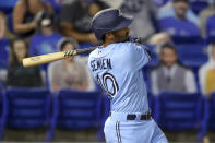 Toronto Blue Jays' Marcus Semien follows through on a solo home run against the New York Yankees during the fourth inning of a baseball game Tuesday, April 13, 2021, in Dunedin, Fla. (AP Photo/Mike Carlson)