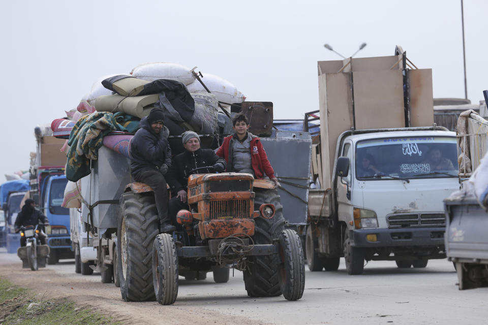 Syrian flee the advance of the government forces in the province of Idlib, Syria, towards the Turkish border, Wednesday, Jan. 29, 2020. Syrian government forces captured one of the largest and most strategic rebel-held towns in the country's northwest, the Syrian military and opposition activists said Wednesday, part of a Russian-backed military assault that has displaced hundreds of thousands of people fleeing to safer areas. (AP Photo/Ghaith Alsayed)