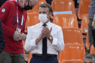 French President Emmanuel Macron applauds as he watches a women's 3-on-3 basketball game between France and the United States at the 2020 Summer Olympics, Saturday, July 24, 2021, in Tokyo, Japan. (AP Photo/Jeff Roberson)