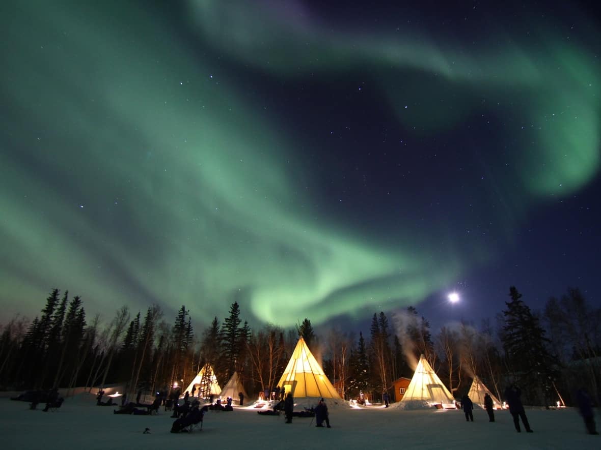 Aurora watchers take in the lights at Aurora Village on March, 11, 2011. Recently, the tourism destination became an on-the-land healing camp for people experiencing homelessness, but the project only has funding for 60 days. (Aurora Village - image credit)