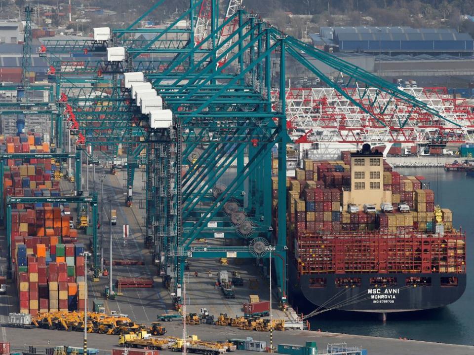  A container ship of the Mediterranean Shipping Company S.A. next to cranes at the San Antonio port in Chile.