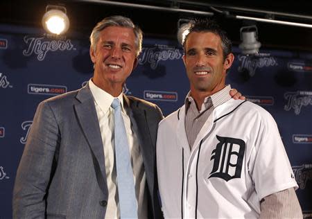 Detroit Tigers General Manager Dave Dombrowski (L ) and newly named Tigers manager Brad Ausmus pose together during a press conference where Ausmus was named the 37th manager in franchise history of the Tigers in Detroit, Michigan November 3, 2013. REUTERS/Rebecca Cook