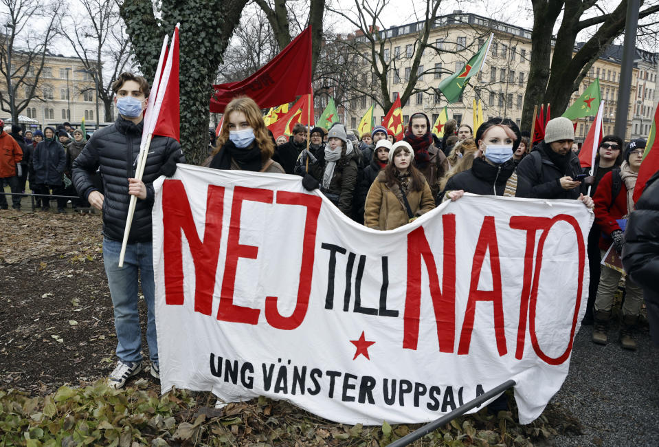 People take part in a demonstration against Turkish President Recep Tayyip Erdogan and Sweden's NATO bid arranged by The Kurdish Democratic Society Center in Sweden, in Stockholm, Saturday, Jan. 21. 2023. Sign reads in Swedish "No to NATO". Turkey has blocked Sweden and Finland’s bids to join NATO, which needs approval by all member states, saying Sweden in particular needs to crack down on Kurdish and other groups that Ankara considers as terrorists. (Christine Olsson/TT via AP)