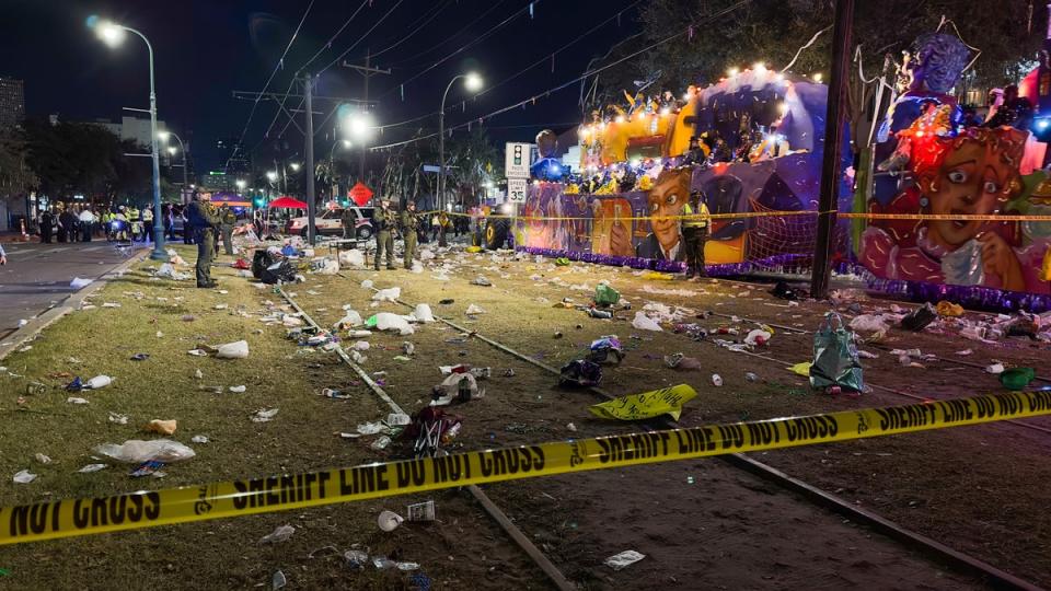 Police work the scene of a shooting at the Krewe of Bacchus parade on Sunday. (AP)