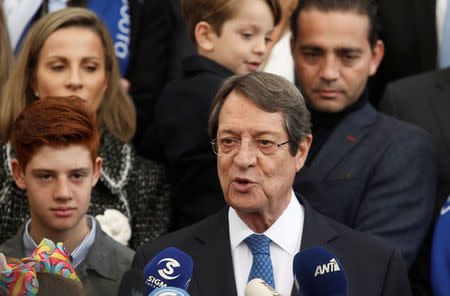 Presidential candidate Nicos Anastasiades talks to the media after casting his ballot, during the second round of the presidential election in Limassol, Cyprus February 4, 2018. REUTERS/Yiannis Kourtoglou