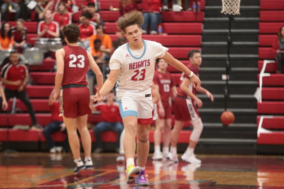 Shawnee Heights sophomore Jaret Sanchez (23) reacts to making a three-pointer against Seaman during the first quarter of Friday's game.