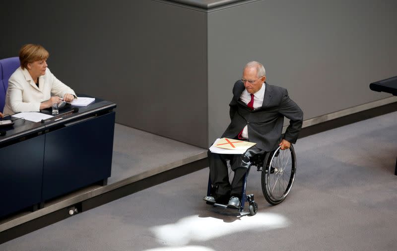 FILE PHOTO: German Finance Minister Wolfgang Schaeuble leaves the podium after he gave a speech for a budget debate at the German national parliament in Berlin