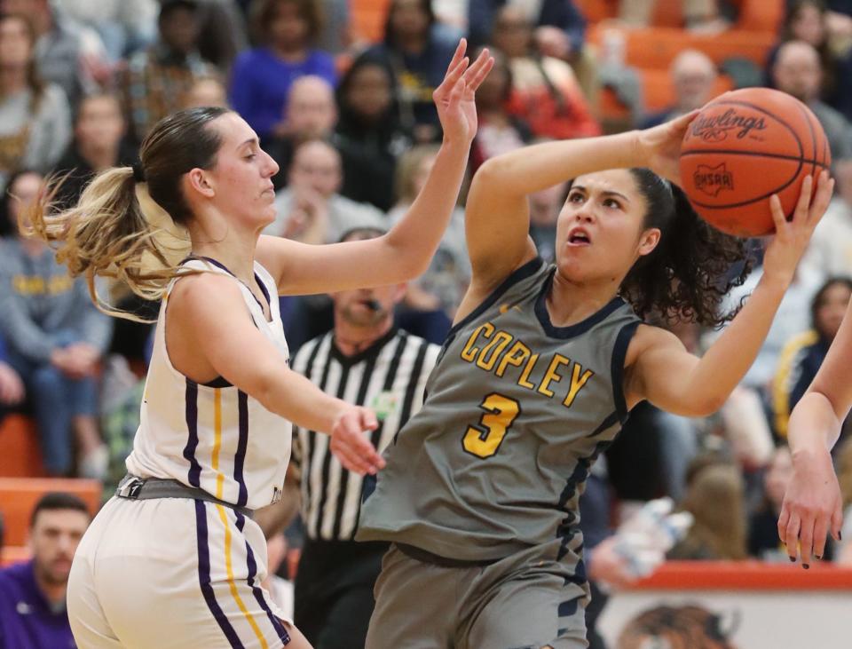 Bryan's Anna Gray defends as Copley's Izzy Callaway makes a move to shoot in a Division II regional final March 8 in Mansfield.