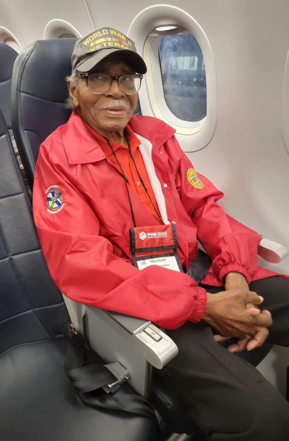 World War II veteran Herman Jenkins of Lakeland rides a plane to Washington, D.C., last year as part of the Honor Flight program. Jenkins died Friday at age 104.