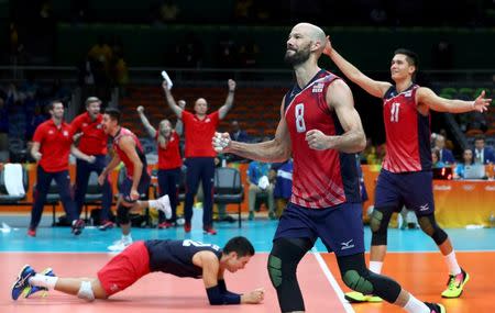 2016 Rio Olympics - Volleyball - Final - Men's Bronze Medal Match USA v Russia - Maracanazinho - Rio de Janeiro, Brazil - 21/08/2016. William Priddy (USA) of USA and Micah Christenson (USA) of USA celebrate at the end of the match. REUTERS/Yves Herman