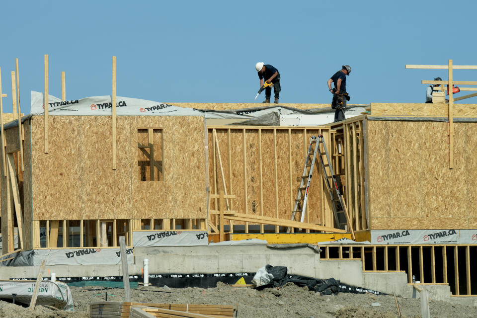 Statistics Canada will release its labour force survey report for November on Friday. Workers are shown at new housing development in Pickering, Ont. on Monday, May 15, 2023.THE CANADIAN PRESS/Chris Young