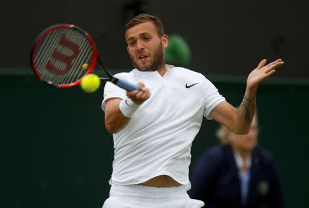 Britain Tennis - Wimbledon - All England Lawn Tennis & Croquet Club, Wimbledon, England - 29/6/16 Great Britain's Dan Evans in action against Ukraine's Alexandr Dolgopolov REUTERS/Paul Childs