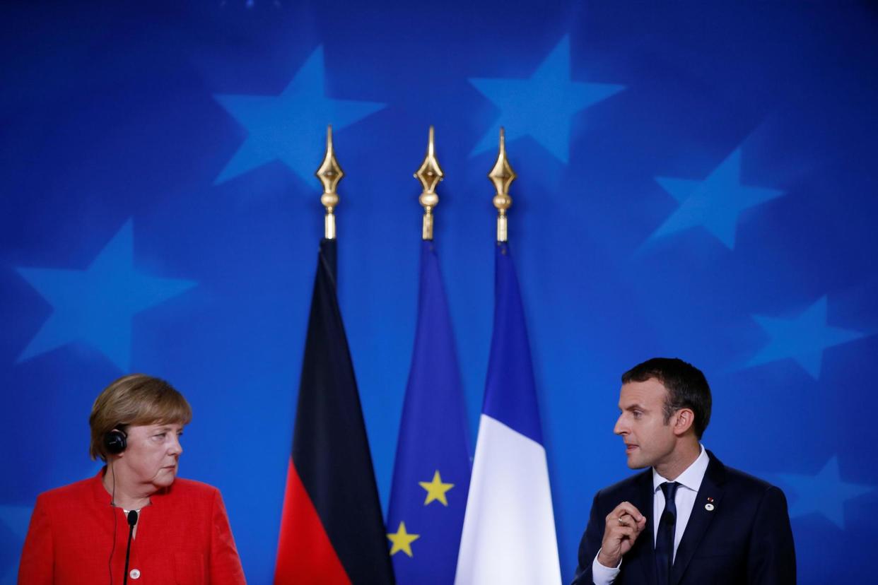 United: German Chancellor Angela Merkel and French President Emmanuel Macron: REUTERS