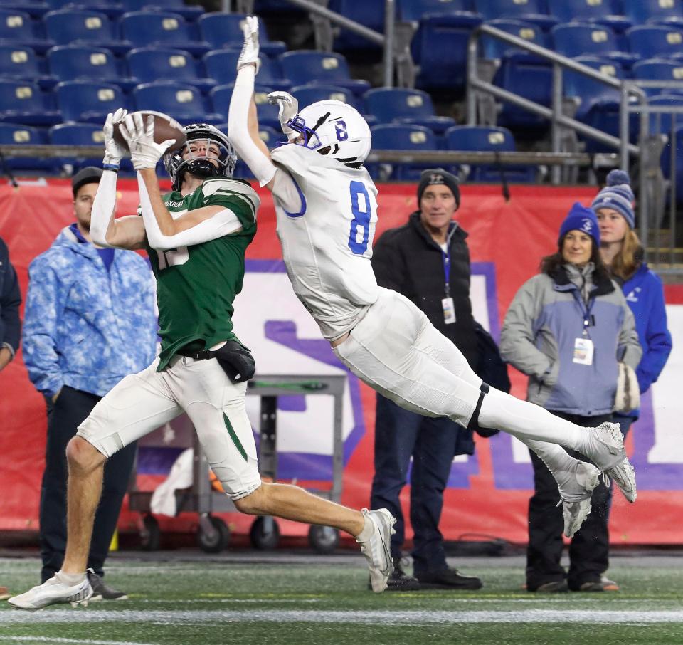 Scituate Sailor Lawson Foley leaps to block a Duxbury pass to #13 Zach Falls for a big gain and first down.

Duxbury High and Scituate High play the MIAA Division 4 State Championship at Gillette Stadium on Friday Dec. 1, 2023