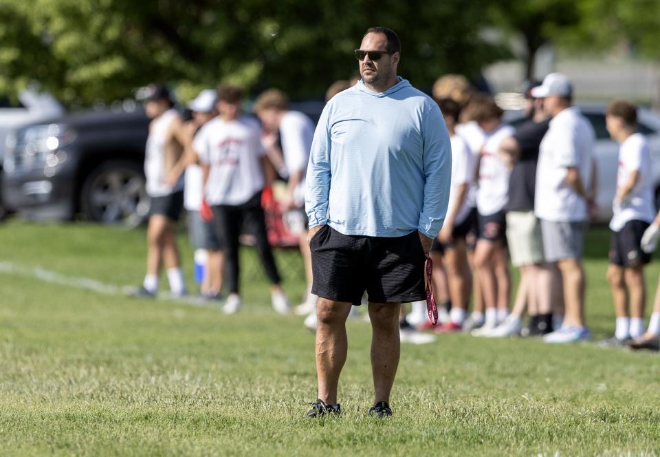 Mike Wilson watches his son Isaac Wilson during a 7-on-7 passing league game in Layton on Friday, June 9, 2023. | Scott G Winterton, Deseret News