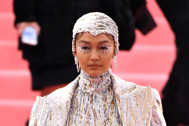 Gigi Hadid Goes Futuristic in Sequins & Pants That Melt Into