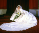 <p>Diana’s most iconic outfit was undoubtedly her wedding dress. Created by David and Elizabeth Emanuel, the out-there frothy gown was designed to make a statement with its dramatic 25-foot train and thousands of pearl embellishments. And boy did Diana rock it!</p><p><i>[Photo: PA]</i></p>