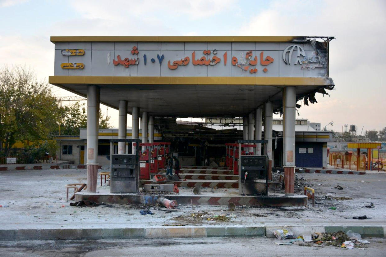 A scorched gas station that had been set ablaze by protesters.