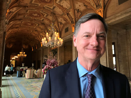 FILE PHOTO: Charles Evans, president of the Federal Reserve Bank of Chicago, poses for a photo in Palm Beach, Florida, U.S. January 17, 2018. REUTERS/Ann Saphir