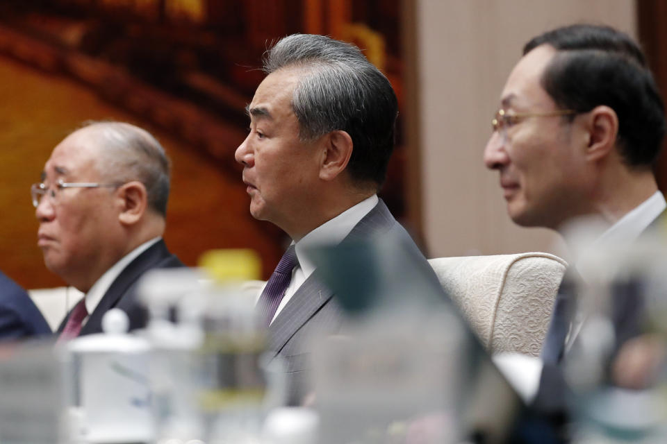 Chinese top diplomat Wang Yi, center, attends a meeting with U.S. Special Presidential Envoy for Climate John Kerry, not pictured, at the Great Hall of the People in Beijing Tuesday, July 18, 2023. (Florence Lo/Pool Photo via AP)