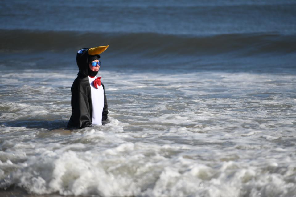 Participants take to the 45-degree water at the 26th Annual Atlantic General Hospital Penguin Swim in Ocean City, Maryland, on Jan. 1, 2020.