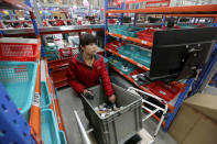 An employee works at a JD.com logistics centre in Langfang, Hebei province, November 10, 2015. REUTERS/Jason Lee/File Photo