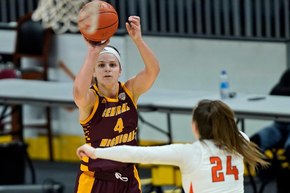 Central Michigan's Maddy Watters shoots over Bowling Green's Kenzie Lewis during the first half of CMU's 77-72 win in the MAC tournament final on Saturday, March 13, 2021, in Cleveland.