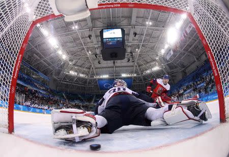 Ice Hockey - Pyeongchang 2018 Winter Olympics - Men's Quarterfinal Match - Czech Republic v U.S. - Gangneung Hockey Centre, Gangneung, South Korea - February 21, 2018 - Petr Koukal of the Czech Republic scores the winning goal in a shootout past goalie Ryan Zapolski of U.S. REUTERS/Ronald Martinez/Pool