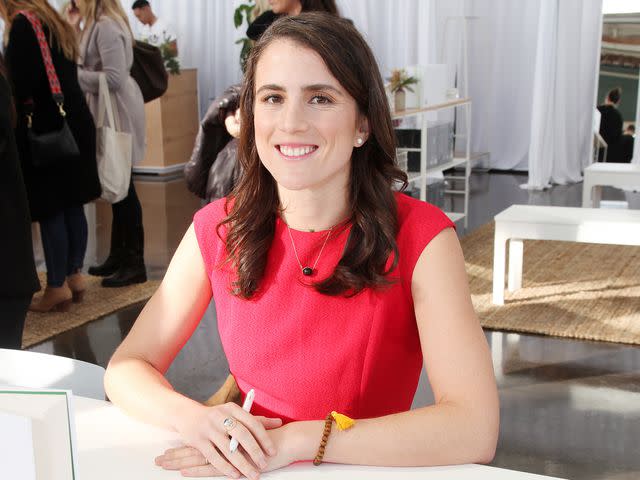 <p>Amber De Vos/Getty</p> Tatiana Schlossberg at her book signing in 2019.