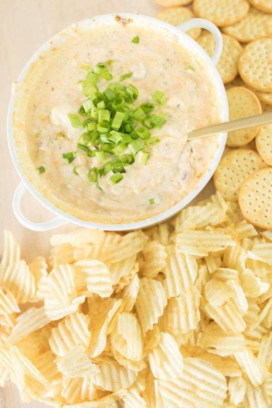<p>Julie Blanner</p><p>Incredibly easy Bacon Cheese Dip that’s always a favorite for game day or get-togethers! This creamy mix of bacon, cheddar, cream cheese and sour cream topped with green onion is irresistible! </p><p><a href="https://julieblanner.com/bacon-cheddar-cheese-dip-recipe/" rel="nofollow noopener" target="_blank" data-ylk="slk:Get the Recipe;elm:context_link;itc:0;sec:content-canvas" class="link ">Get the Recipe</a></p>
