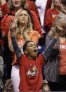 A Louisville fan cheers before an NCAA Midwest Regional semifinal college basketball tournament game against the Kentucky Friday, March 28, 2014, in Indianapolis. (AP Photo/David J. Phillip)