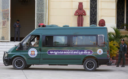 A police vehicle brings Australia filmmaker James Ricketson (inside vehicle), to the Supreme Court of Phnom Penh, Cambodia January 30, 2018. REUTERS/Samrang Pring