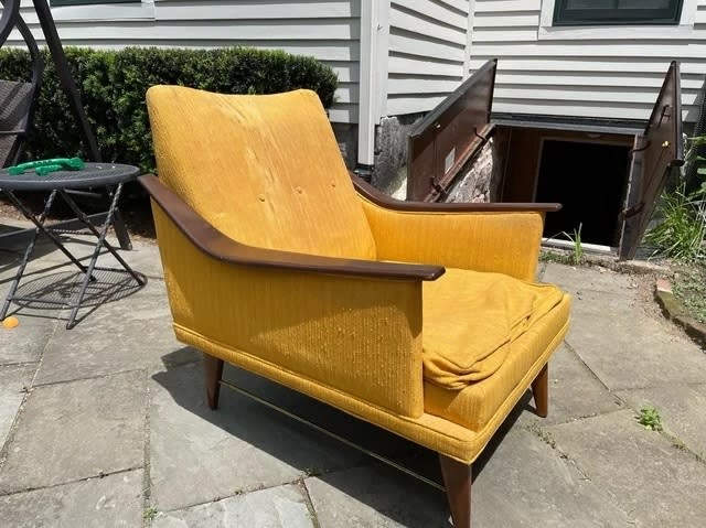 A before image of a yellow armchair with frayed and stained fabric