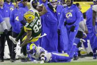 Los Angeles Rams' Nick Scott stops Green Bay Packers' Marquez Valdes-Scantling during the second half of an NFL football game Sunday, Nov. 28, 2021, in Green Bay, Wis. (AP Photo/Matt Ludtke)