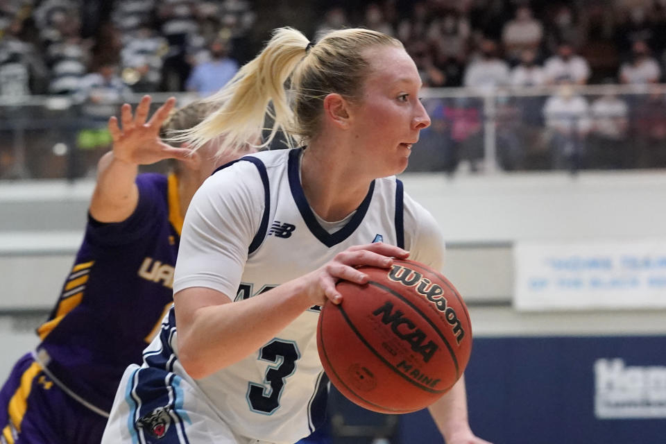 FILE - Maine's Anne Simon drives during the second half of an NCAA college basketball game in the Championship of the America East Conference tournament, Friday, March 11, 2022, at Orono, Maine. For two of the last three seasons, Simon has earned a dual honor as the America East Conference’s overall player of the year and defensive player of the year. (AP Photo/Robert F. Bukaty, File)