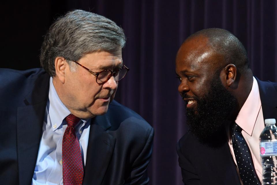 US Attorney General William Barr (L) speaks to JaRon Smith, Deputy Assistant to the President and Deputy Director of the Office of American Innovation, during a roundtable with the US president and faith leaders, law enforcement officials, and small business owners at Gateway Church Dallas Campus in Dallas, Texas, on June 11, 2020. (Photo by Nicholas Kamm / AFP) (Photo by NICHOLAS KAMM/AFP via Getty Images)