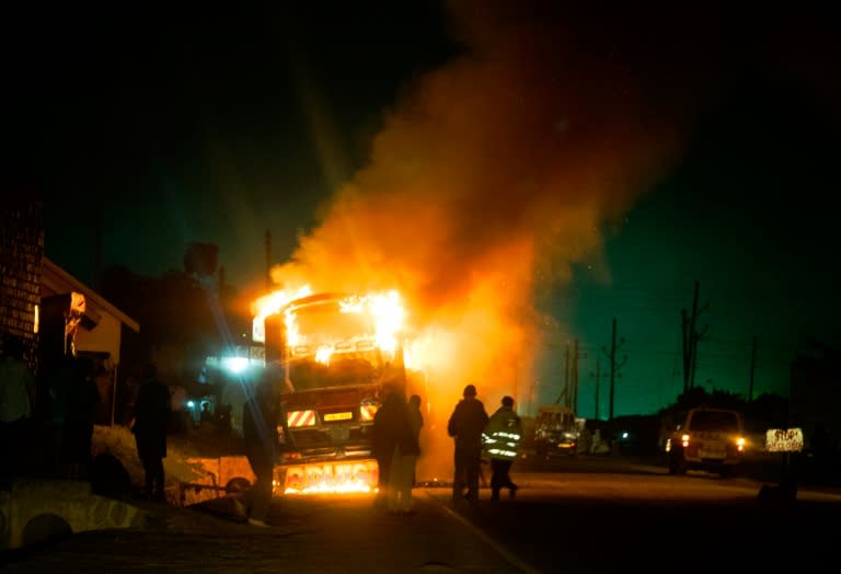 A bus burns on the infamous Kampala-Masaka road, a major access route from the Kenyan coast through Uganda to the Democratic Republic of Congo, Rwanda and Burundi