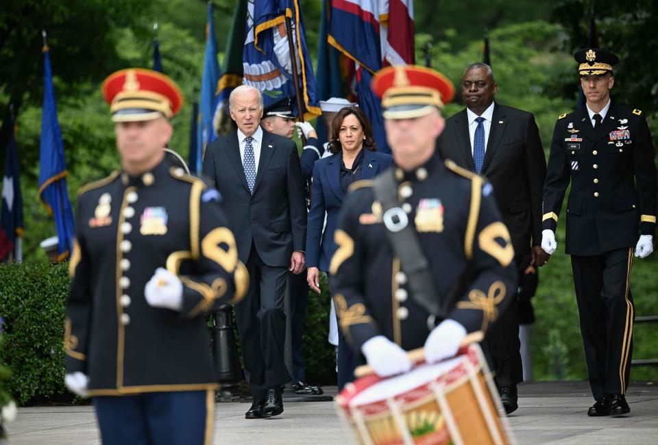 President Joe Biden, Vice President Kamala Harris and Defense Secretary Lloyd Austin participate in a wreath-laying ceremony at Arlington National Cemetery outside Washington, D.C., on May 29, 2023, in observance of Memorial Day.