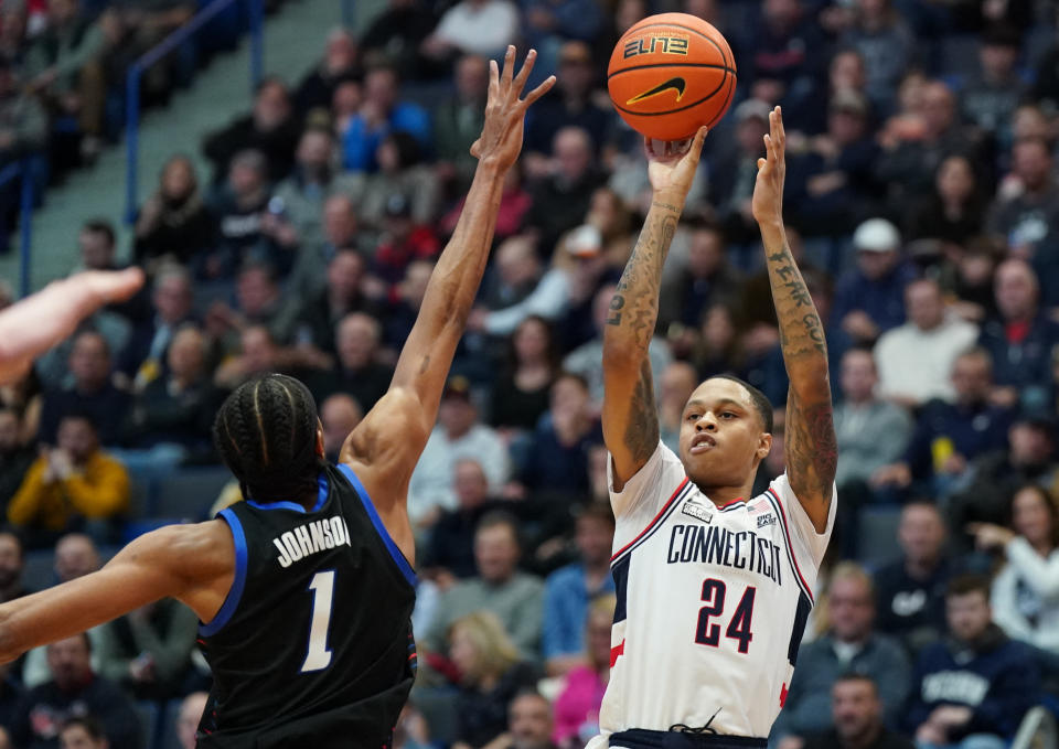 UConn guard Jordan Hawkins shoots against DePaul forward Javan Johnson in the first half at XL Center in Hartford, Connecticut, on March 1, 2023. (David Butler II/USA TODAY Sports)