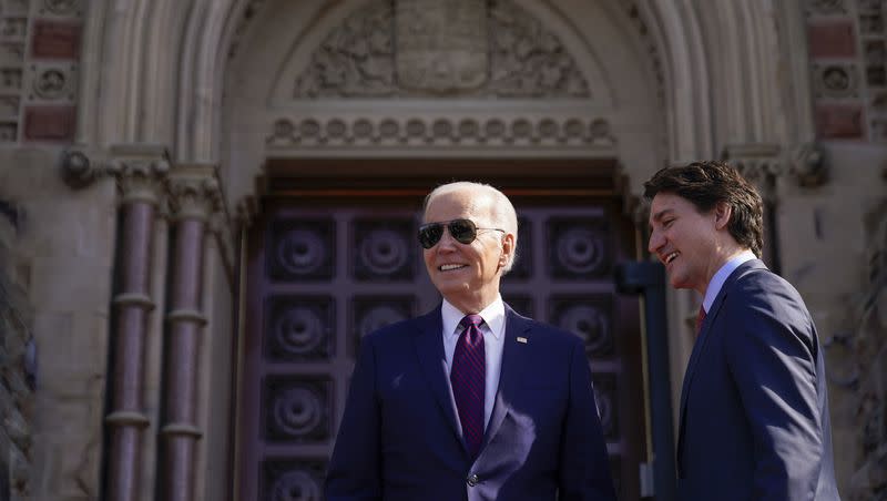 Canadian Prime Minister Justin Trudeau greets President Joe Biden as he arrives at Parliament Hill, Friday, March 24, 2023, in Ottawa, Canada.
