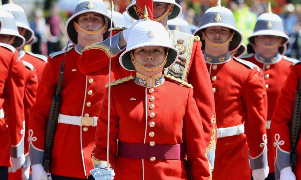 Megan Couto (centre) leads her battalion to make history as the first woman to command the Queen’s Guard at Buckingham Palace.