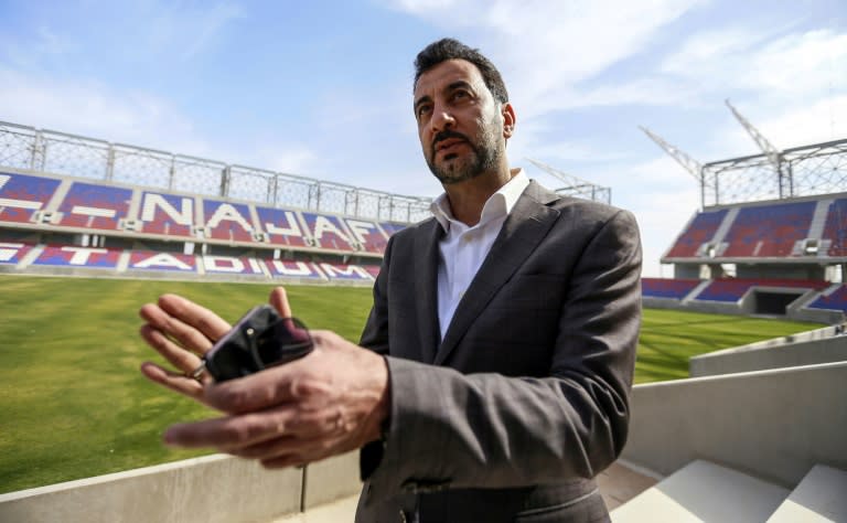 Iraqi Sports and Youth Minister Abdulhussein Abttan speaks during an interview with AFP at Najaf International Stadium