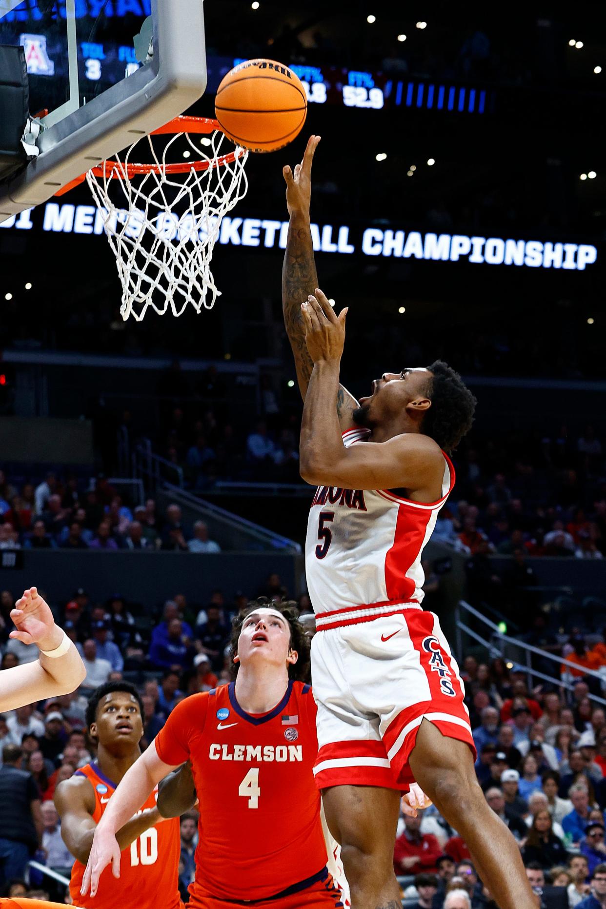 KJ Lewis #5 of the Arizona Wildcats shoots against Ian Schieffelin #4 of the Clemson Tigers during the second half in the Sweet 16 round of the NCAA Men's Basketball Tournament at Crypto.com Arena on March 28, 2024 in Los Angeles.