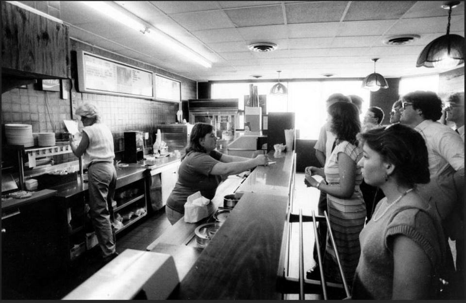 In this photo from 1985, Ellen Johnson, center, took orders at the counter of Lexington’s Tolly-Ho restaurant, on the last day at its original spot, March 11, 1985. The popular campus hangout near the University of Kentucky has been a Lexington institution since 1971, when it opened at what was then 108 West Euclid Avenue, today known as Winslow Street. In March 1985, the 24-hour greasy spoon couldn’t make a deal for a new lease and moved in August 1987 around the corner at 395 South Limestone. The owners rented there until May 2011, when they opened at their current spot, buying the empty Hart’s Dry Cleaning building at 606 South Broadway. At the original restaurant shown here, they sold two eggs, toast and jelly for 99 cents. But a quarter-pound hamburger, known as a Tolly, outsold everything else on the menu by a ratio of 10 to 1.